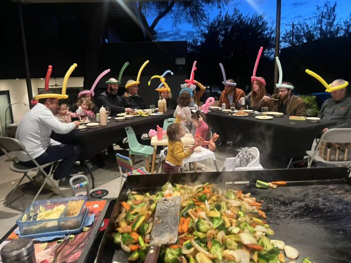 Family enjoying a backyard hibachi dinner in Mississauga for a birthday celebration