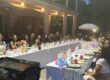 Large family enjoying a backyard hibachi dinner in Richmond Hill for a summer reunion