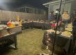 Festive backyard hibachi party setup in Toronto with a private chef cooking at the grill