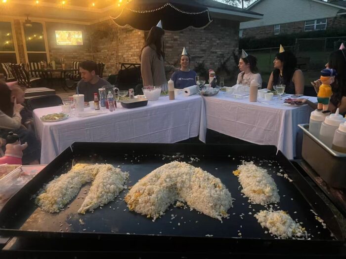 Private hibachi chef serving steak, shrimp and fried rice at a backyard party dinner in Toronto