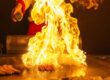 Private hibachi chef cooking with flames on a backyard grill for a Vaughan bridal shower party celebration